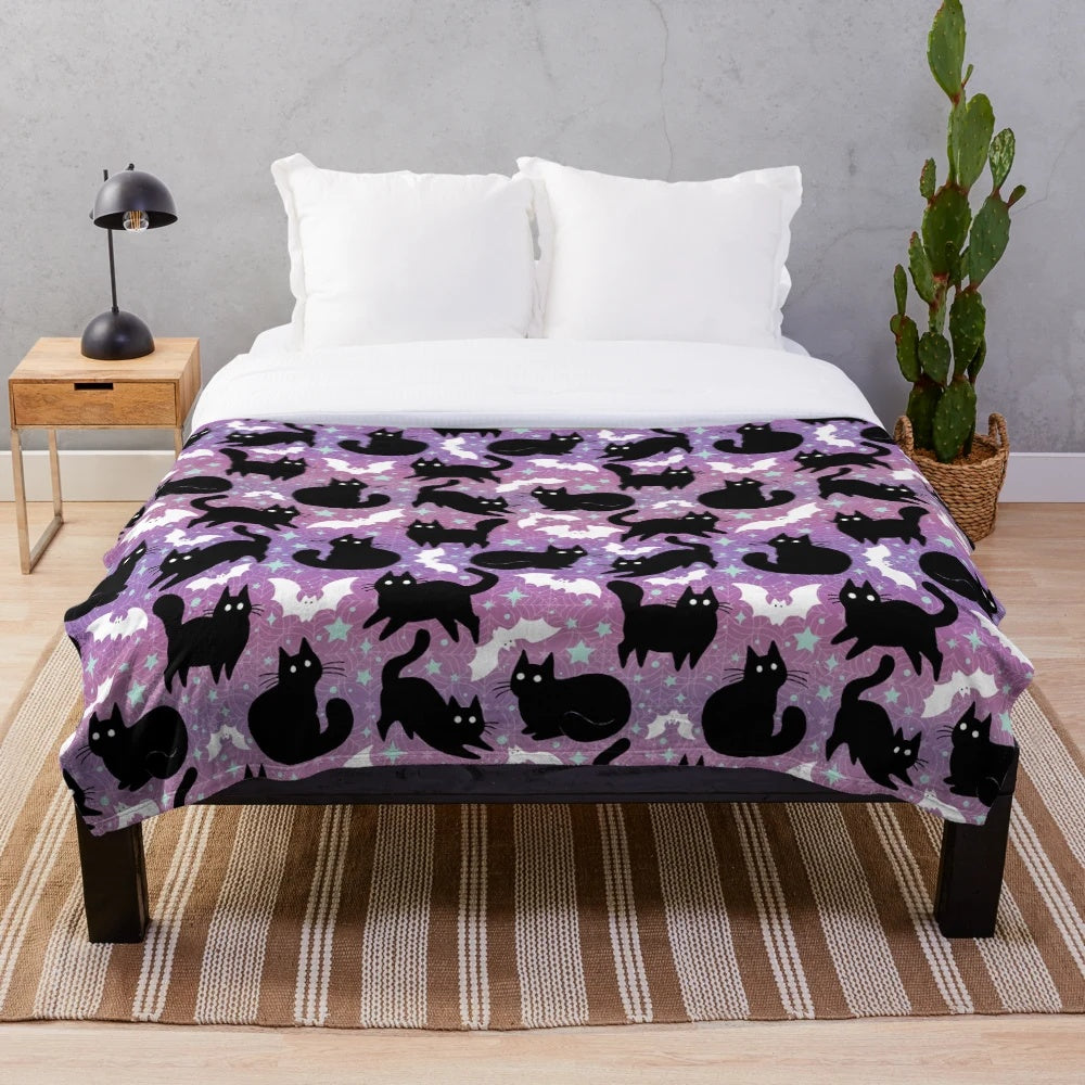 Pastel Halloween plush blanket featuring cute black cats
