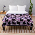 Pastel Halloween plush blanket featuring cute black cats