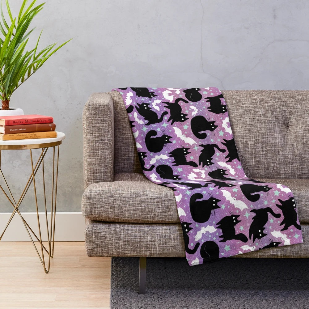 Pastel Halloween plush blanket featuring cute black cats