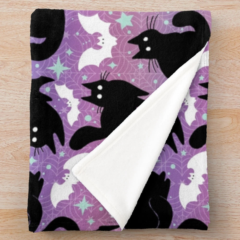 Pastel Halloween plush blanket featuring cute black cats