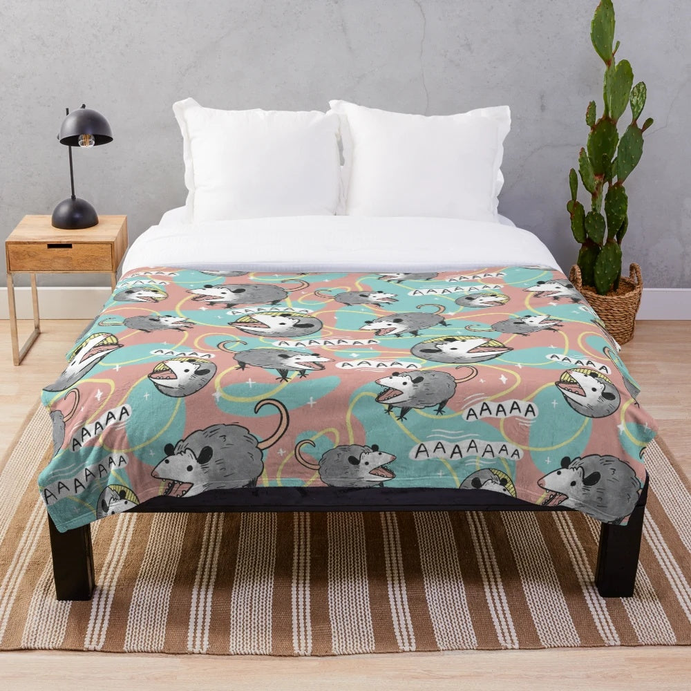 Pastel colored plush blanket featuring a cute opossum making the "screm" meme face