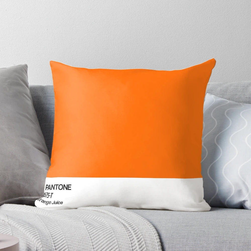 Pastel orange throw pillow with modern, minimalist design