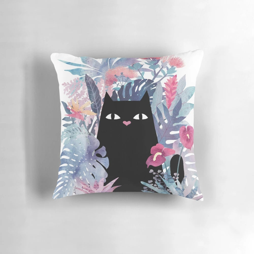 Pastel pillow featuring a whimsical black cat surrounded by tropical foliage and flowers