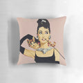 Pastel pink pillow with Audrey Hepburn-inspired design