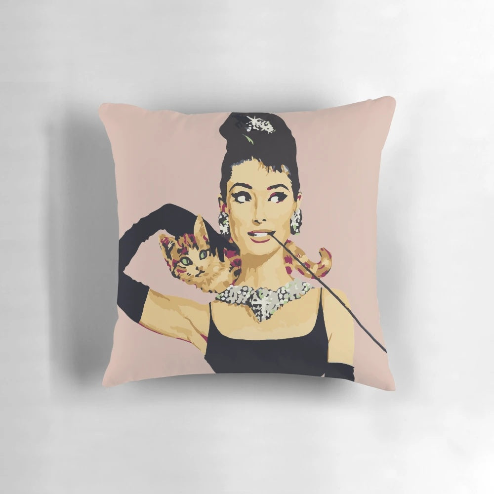 Pastel pink pillow with Audrey Hepburn-inspired design