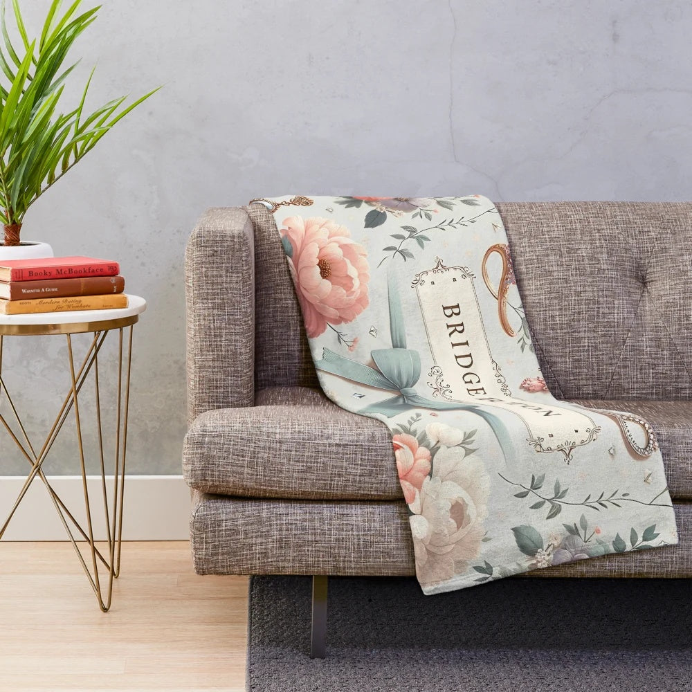 Pastel plush blanket with whimsical Bridgerton-inspired floral and jewelry design