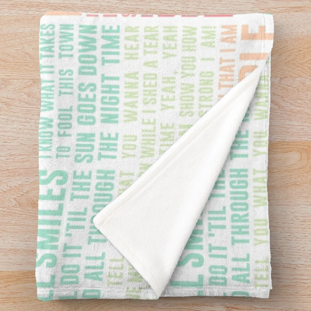 Pastel plush blanket with inspirational "Unstoppable" lyrics by Sia