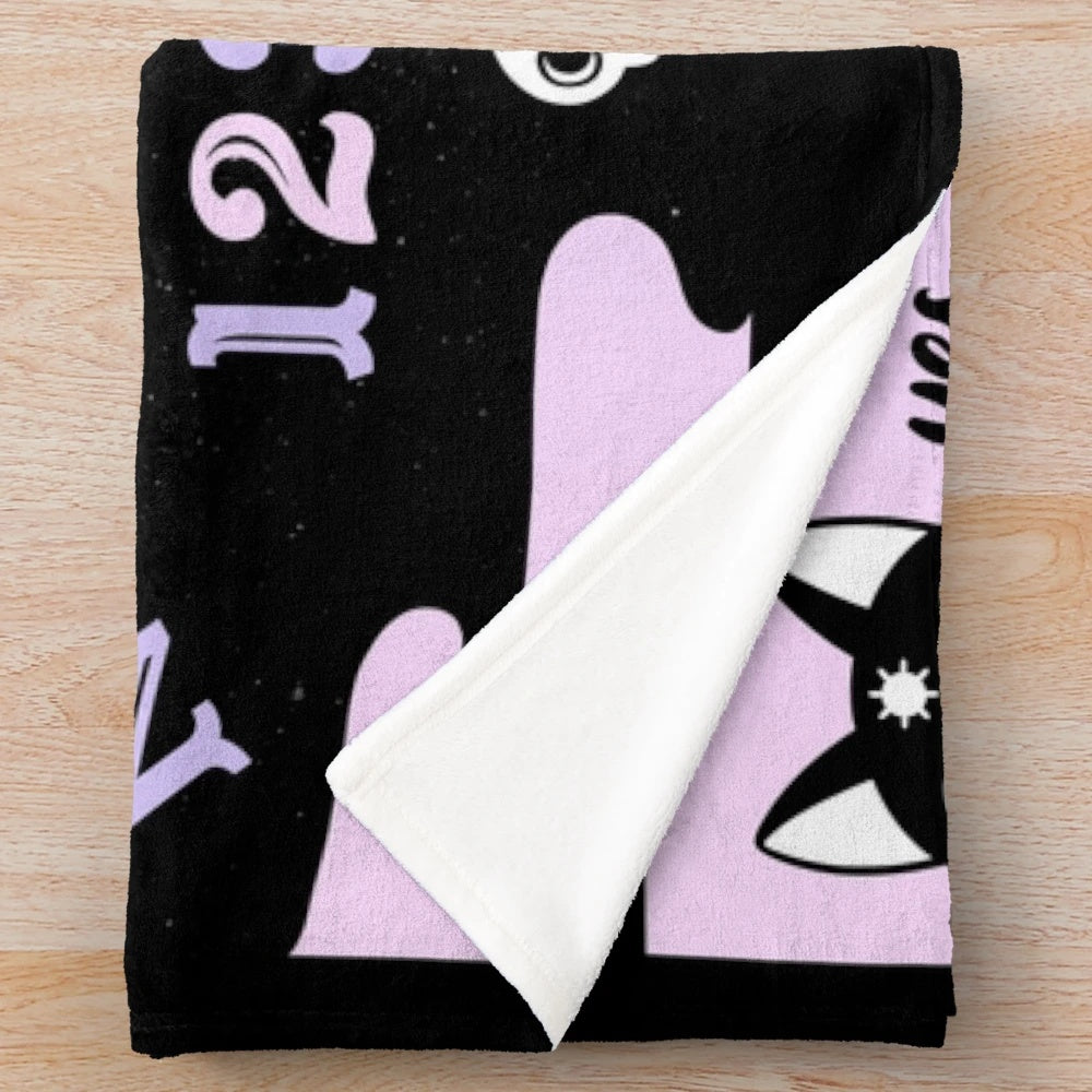 Pastel plush blanket with occult, witchy, and spooky design