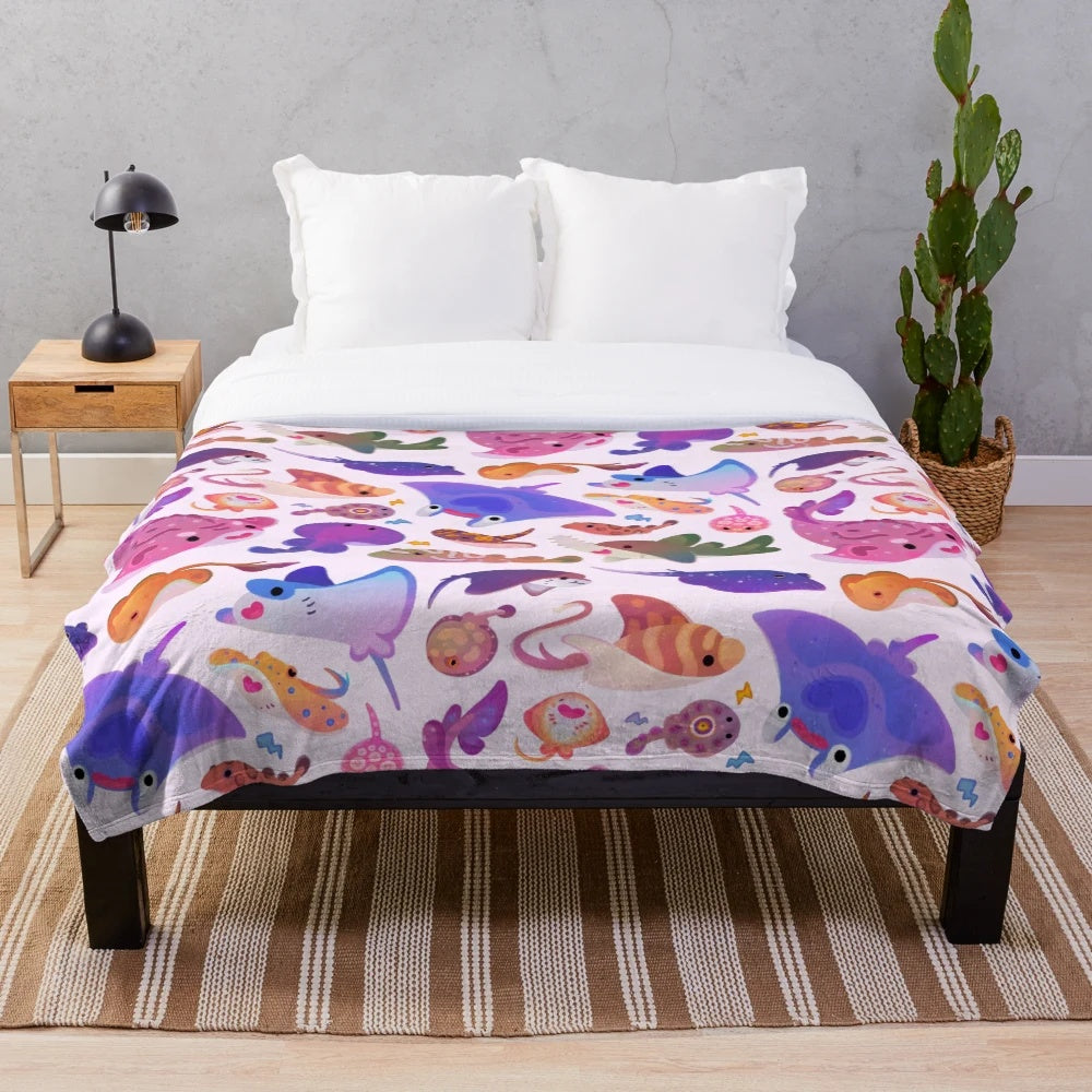 Pastel plush blanket featuring a ray art design