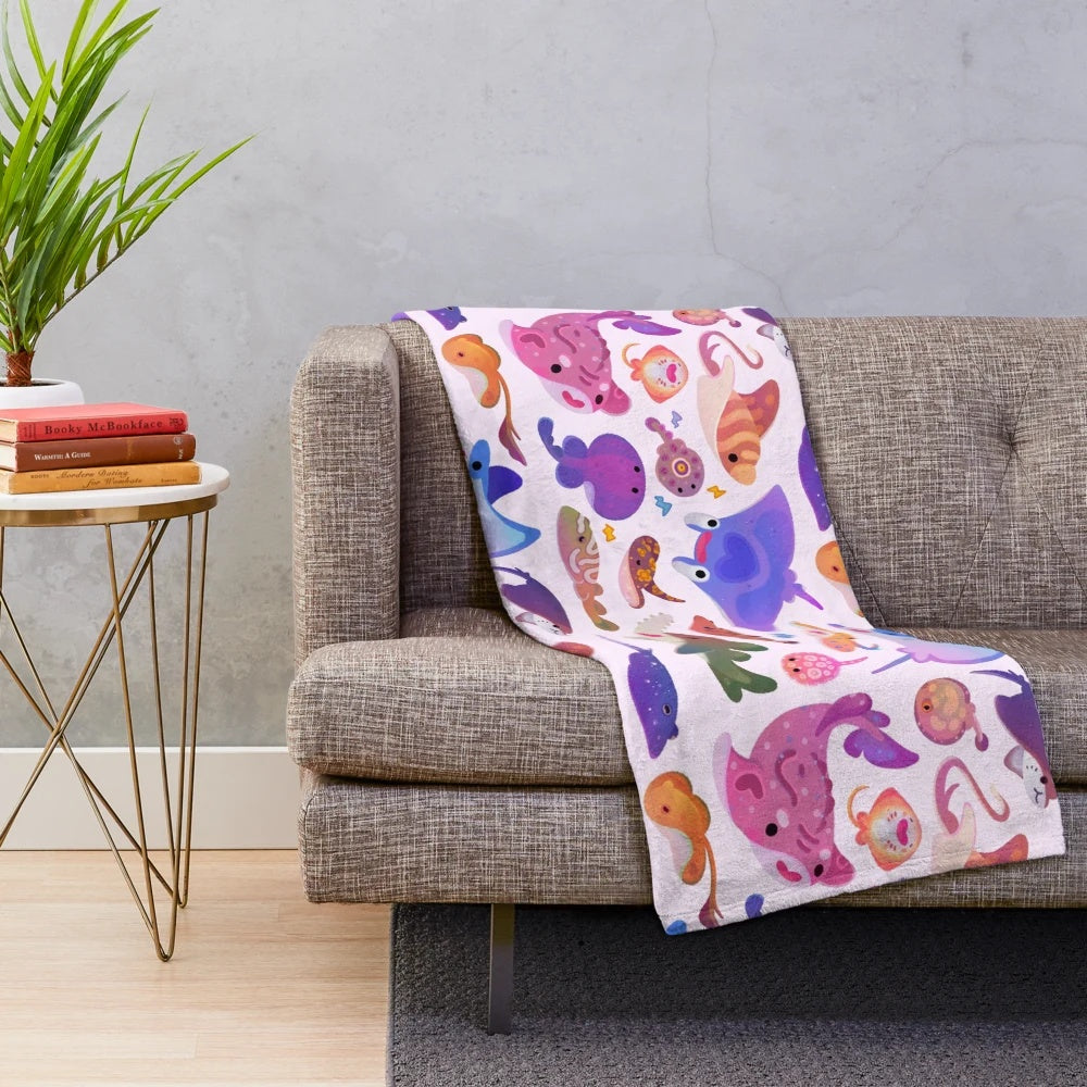 Pastel plush blanket featuring a ray art design