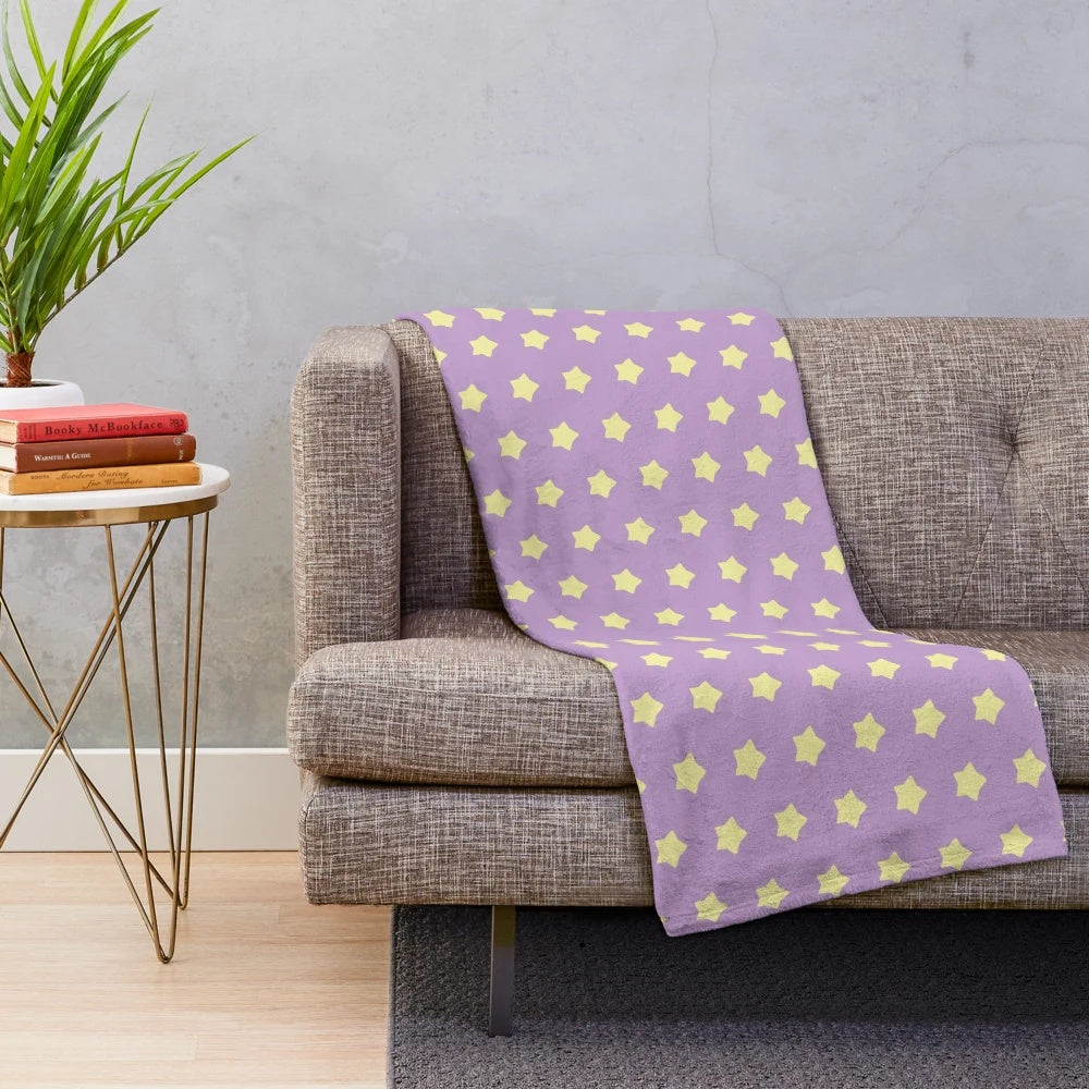 Soft and cozy plush blanket in pastel purple with yellow stars