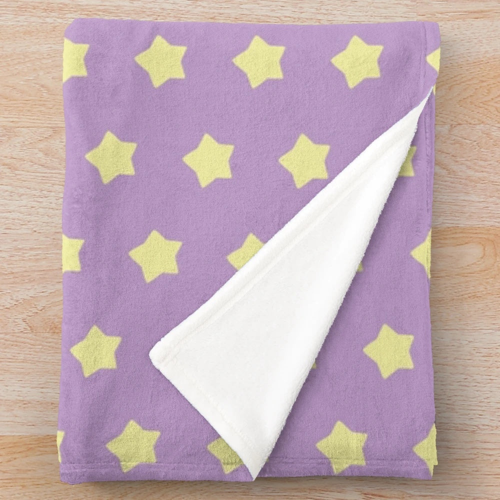 Soft and cozy plush blanket in pastel purple with yellow stars