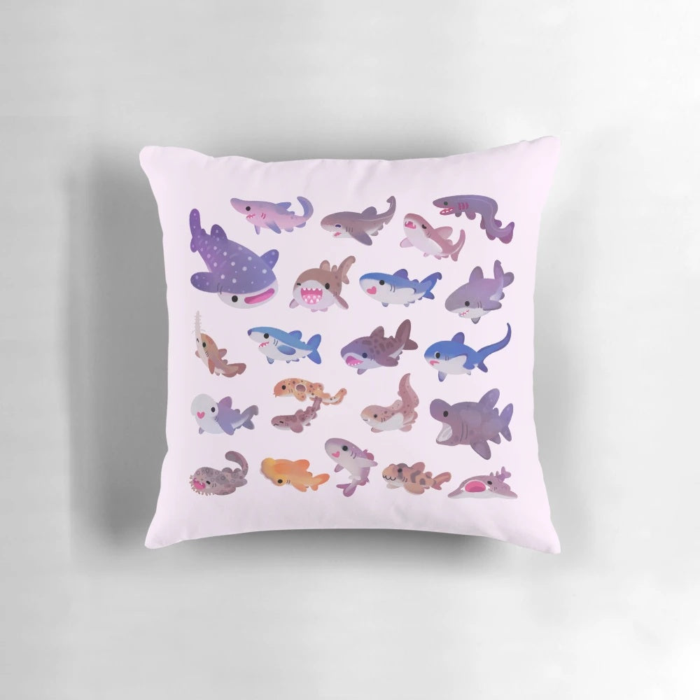 A cozy and colorful pastel shark-themed throw pillow, perfect for adding a touch of marine life to your home decor.