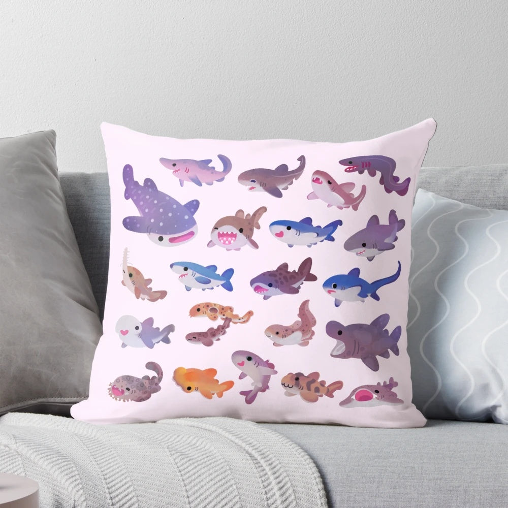 A cozy and colorful pastel shark-themed throw pillow, perfect for adding a touch of marine life to your home decor.