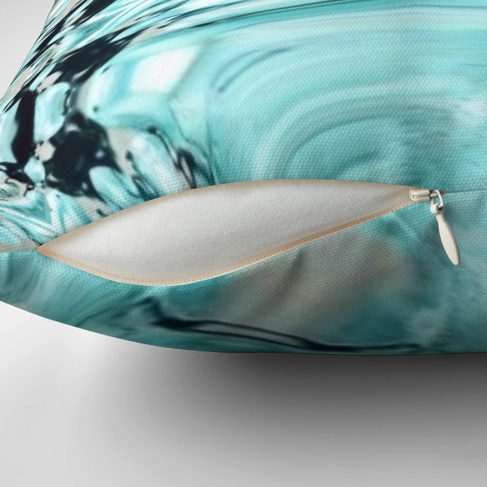 Decorative pillow with an abstract marble swirl pattern in soothing pastel shades of turquoise, aqua, and blue.