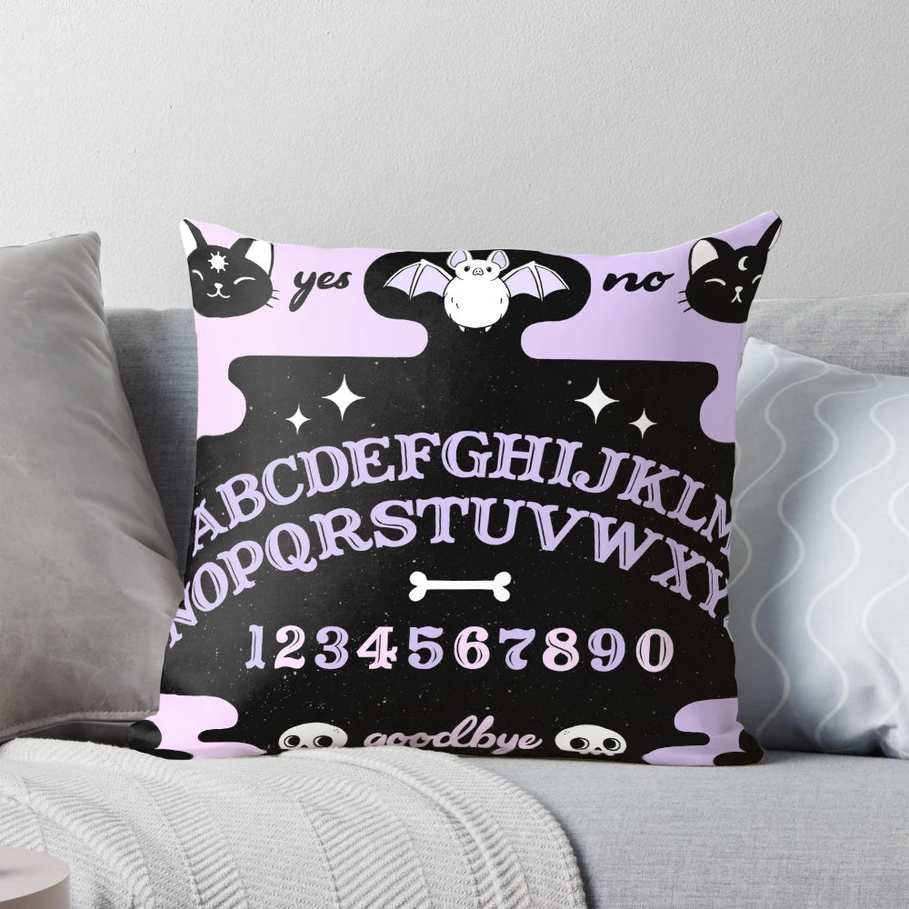 Soft pastel-colored Ouija board-inspired throw pillow with a cat and bat silhouette, perfect for witchy or pagan home decor.