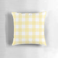 Pastel yellow gingham patterned decorative pillow