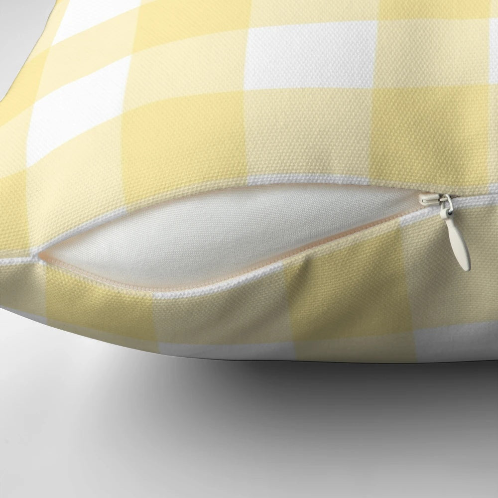 Pastel yellow gingham patterned decorative pillow