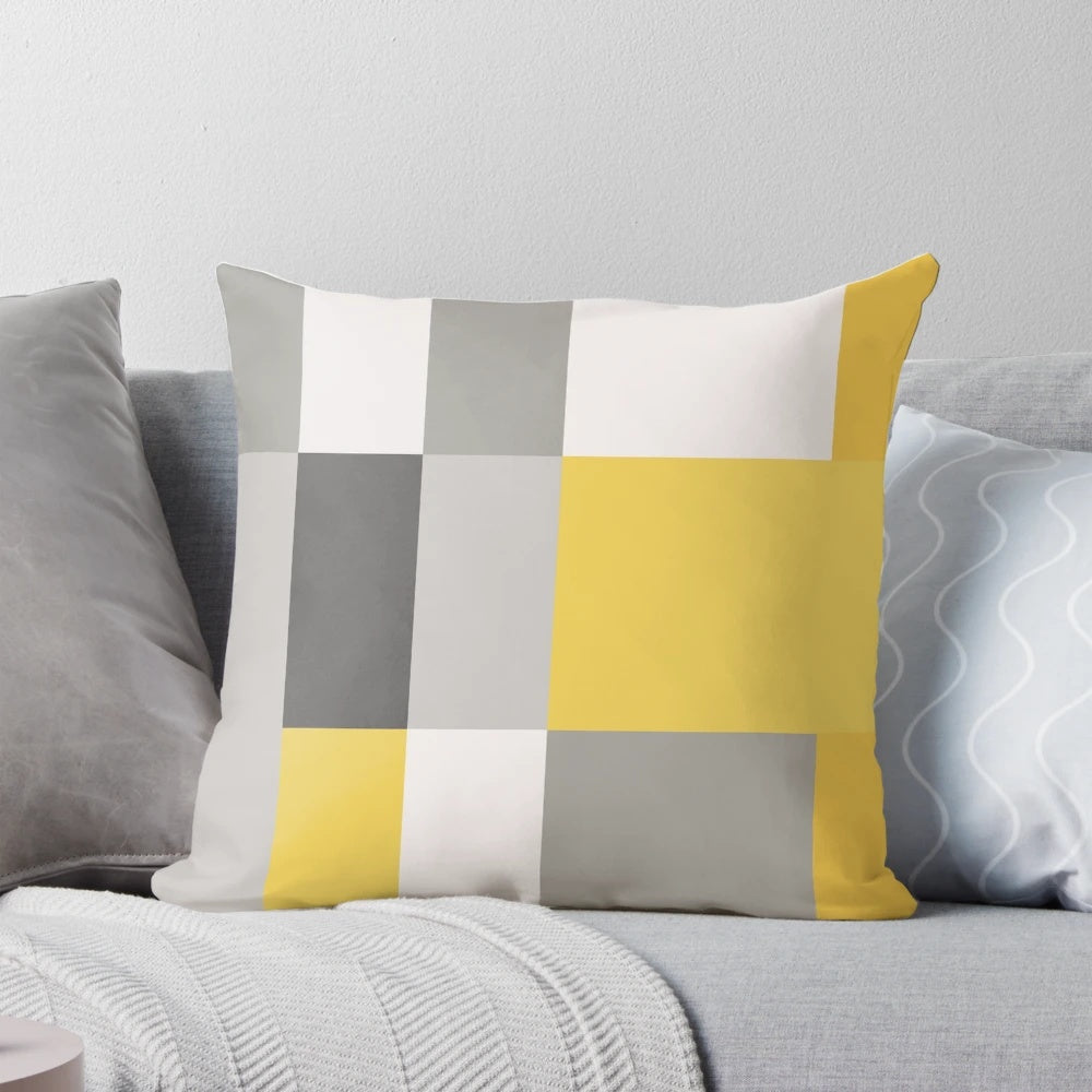 Patchwork pillow in a trendy mustard and grey color scheme