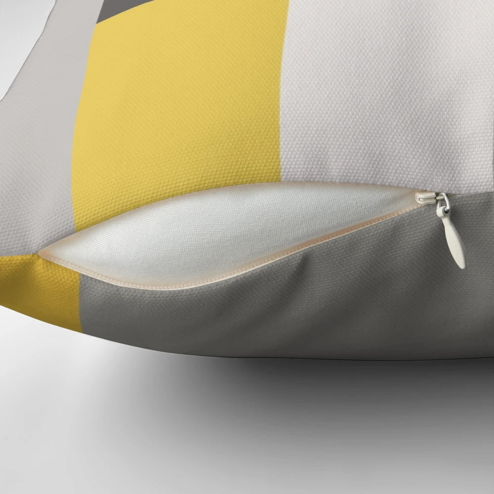 Patchwork pillow in a trendy mustard and grey color scheme