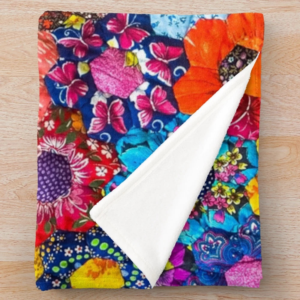 Patchwork plush blanket in colorful pattern