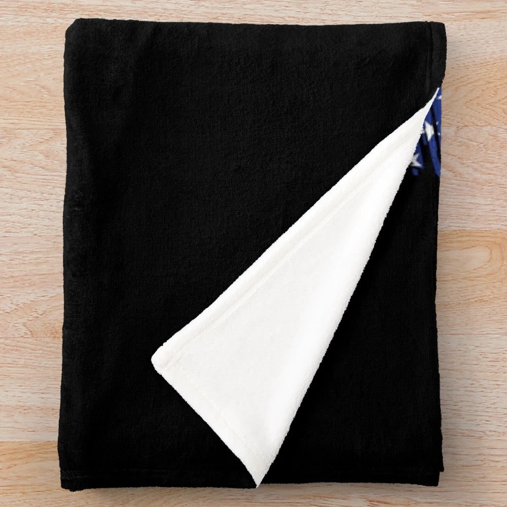 Plush blanket featuring the Canadian flag, maple leaf, and moose