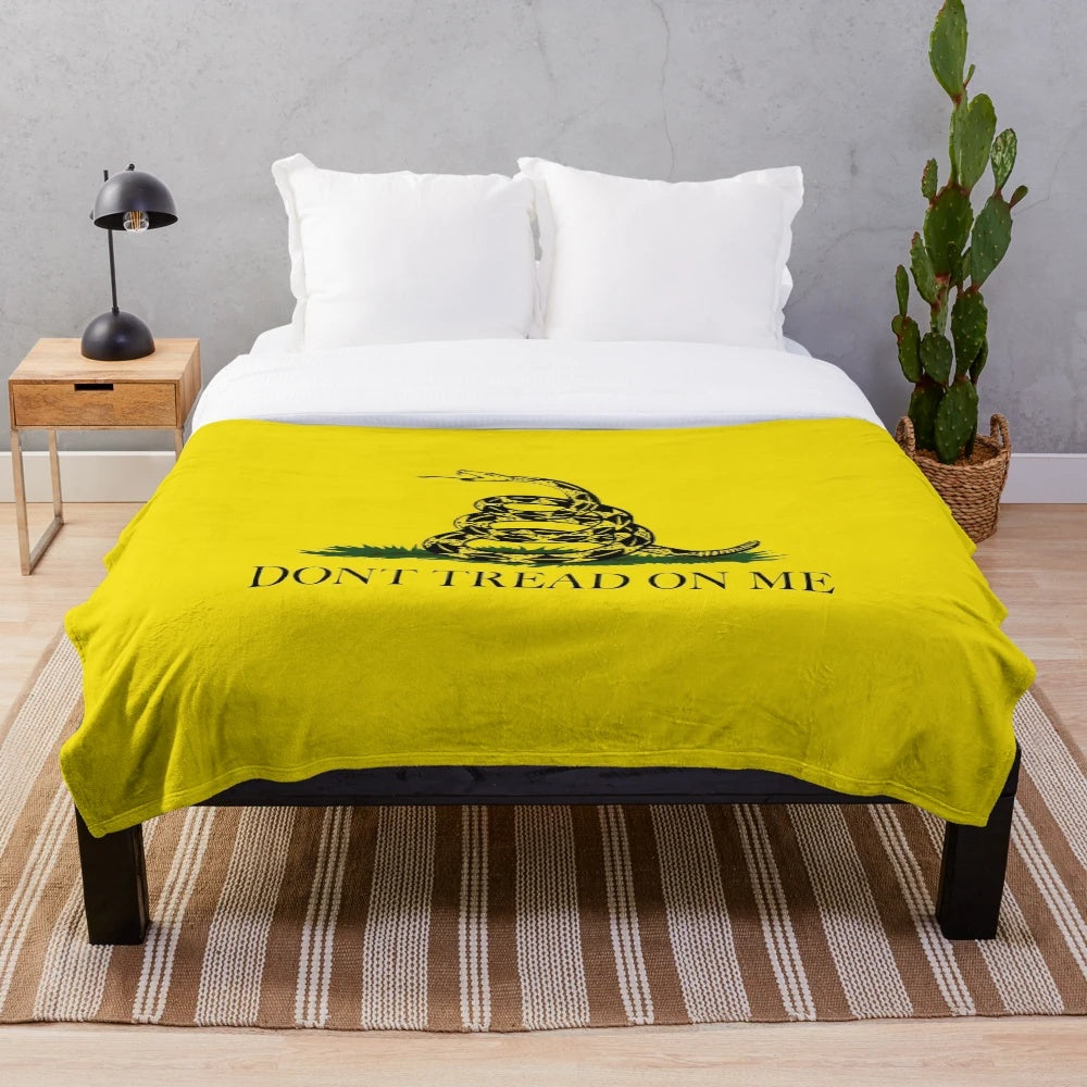 Soft and cozy plush blanket featuring the historic Gadsden Don't Tread On Me flag design