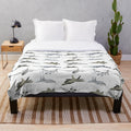 Plush blanket with a variety of military aircraft and patriotic designs