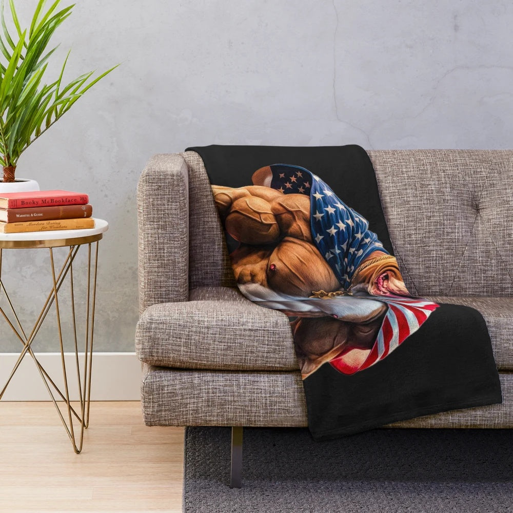 Pitbull dog wrapped in a soft, plush blanket with the American flag design