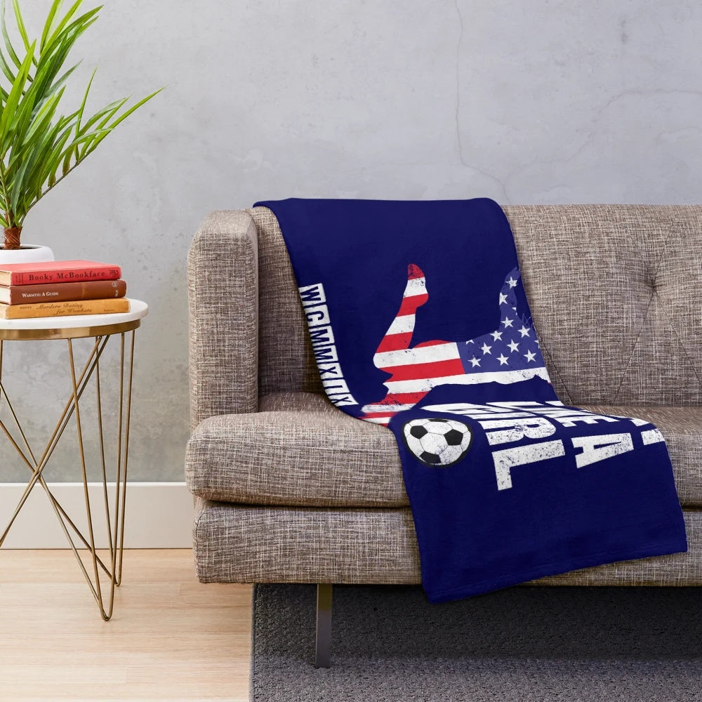 Patriotic plush blanket with USA women's soccer team design