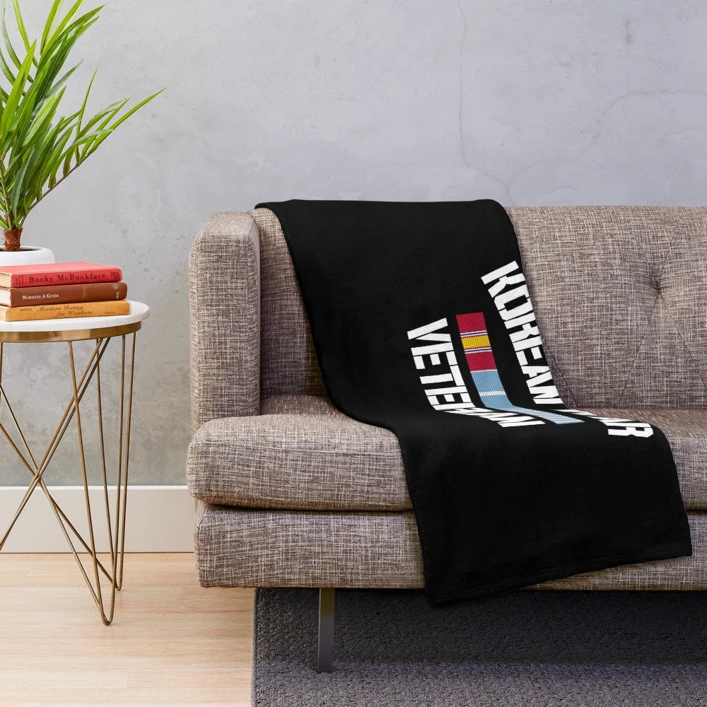 Plush blanket featuring a Korean War service medal design for honoring military veterans