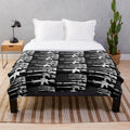 Plush blanket featuring a design with the USA American flag and guns