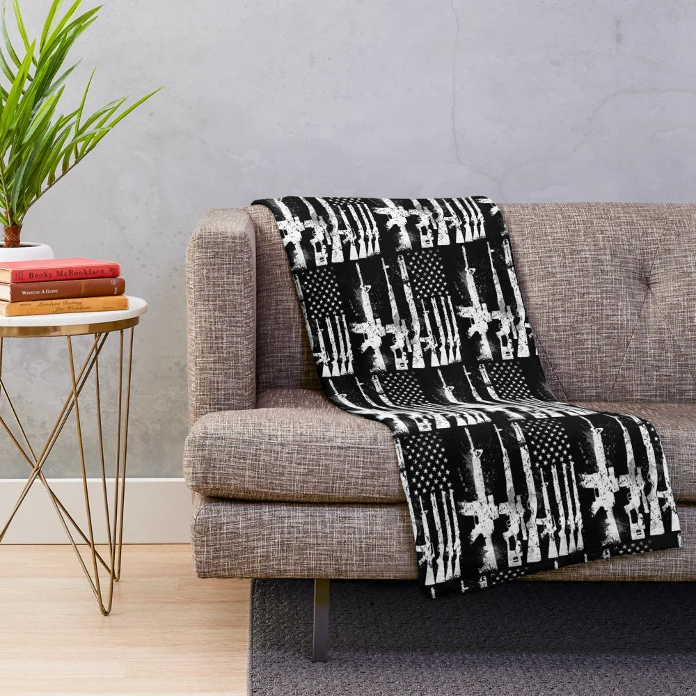 Plush blanket featuring a design with the USA American flag and guns