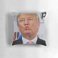 A white pillow with a portrait of former U.S. President Donald Trump printed on the front.