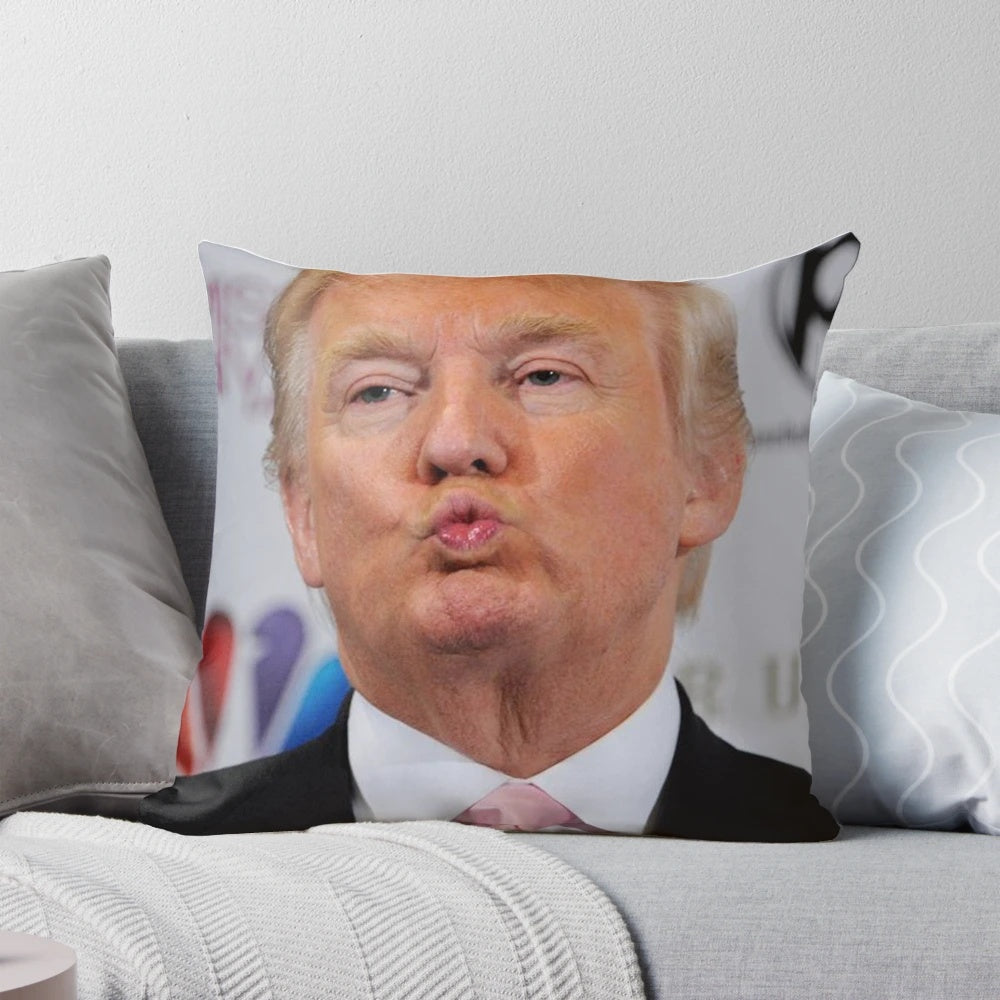 A white pillow with a portrait of former U.S. President Donald Trump printed on the front.