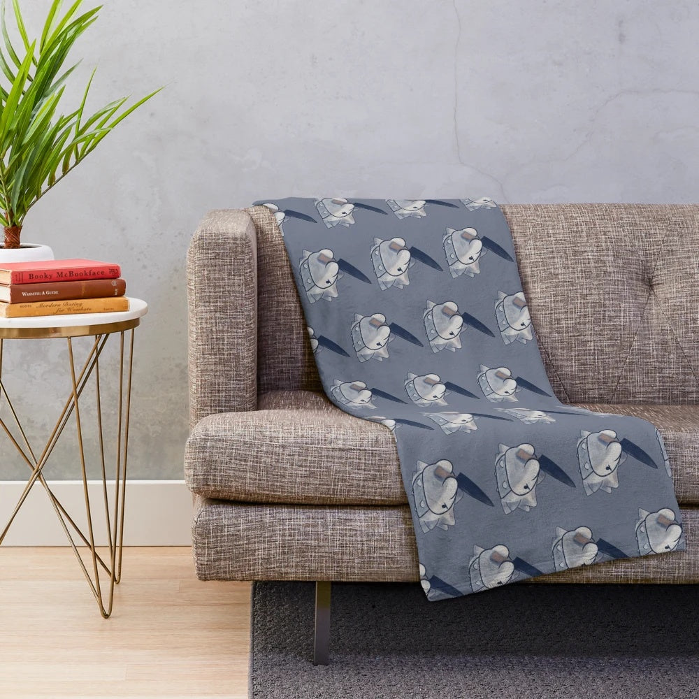 Patterned plush blanket with an angry snom holding a knife