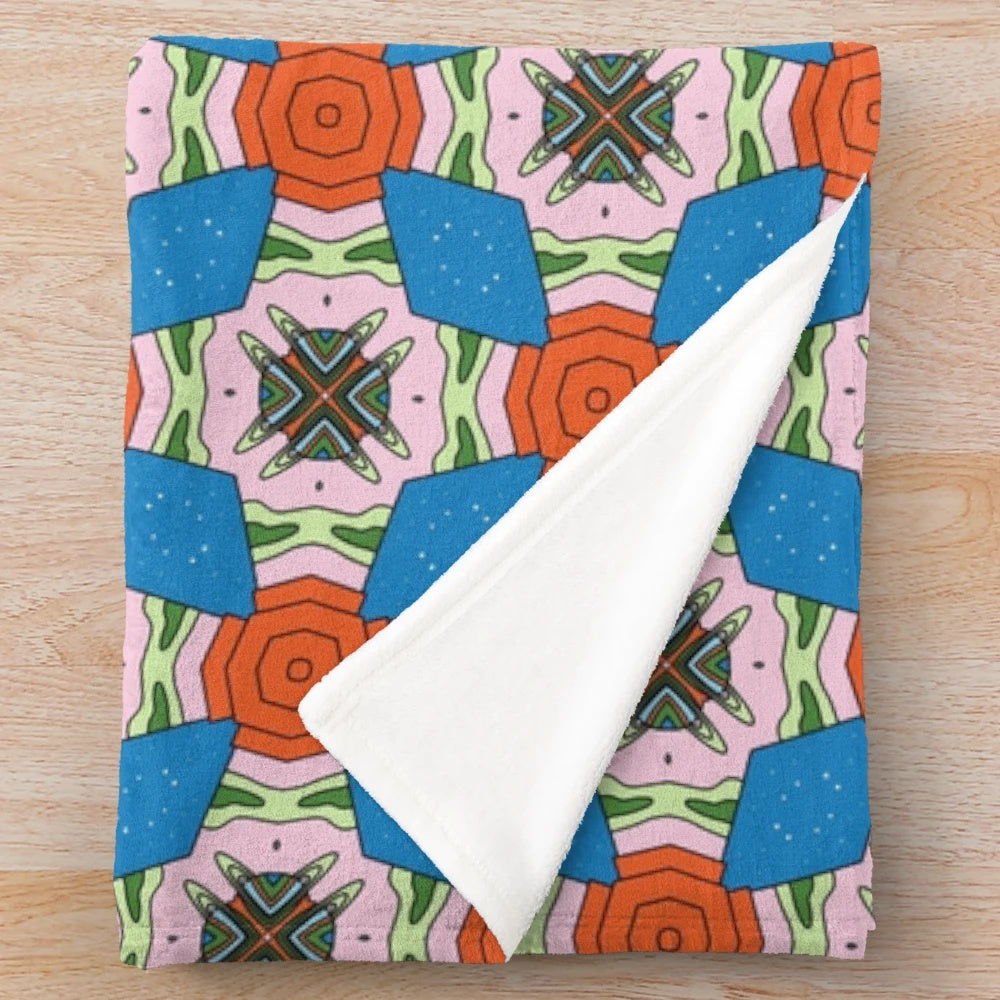 Patterned plush blanket with various designs for a cozy and comfortable living space