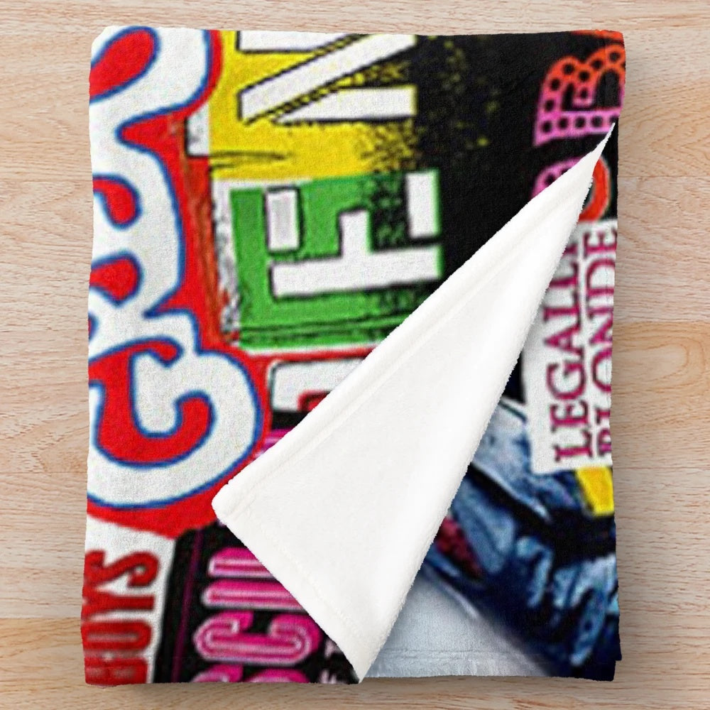 Patterned plush blanket with collage of musical theater imagery