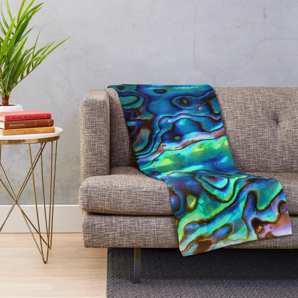 Paua shell inspired plush blanket with kiwi design