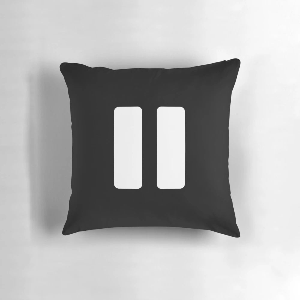 A black and white minimalist music player pause button pillow for music lovers' home decor.