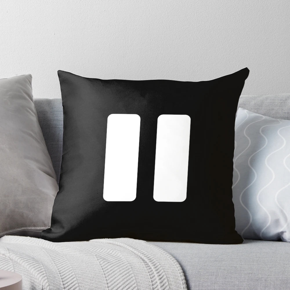 A black and white minimalist music player pause button pillow for music lovers' home decor.