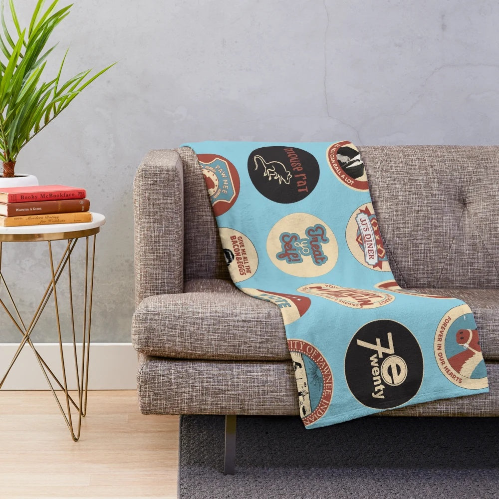Parks and Recreation-themed plush blanket featuring Ron Swanson and Pawnee iconography