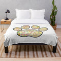 Pawprint inspired plush blanket with Grenada design