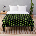 Pea plant plush blanket featuring a black background