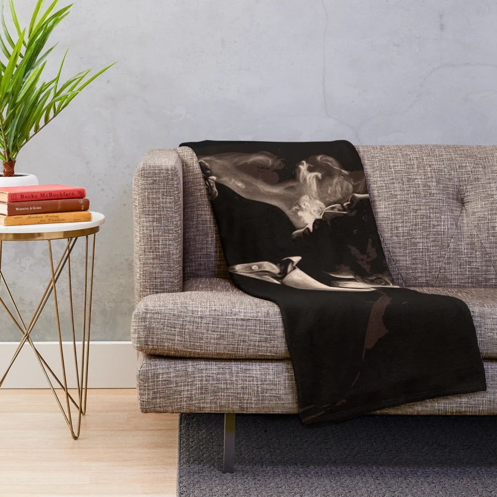 Tommy Shelby from Peaky Blinders smoking a cigarette on a plush blanket