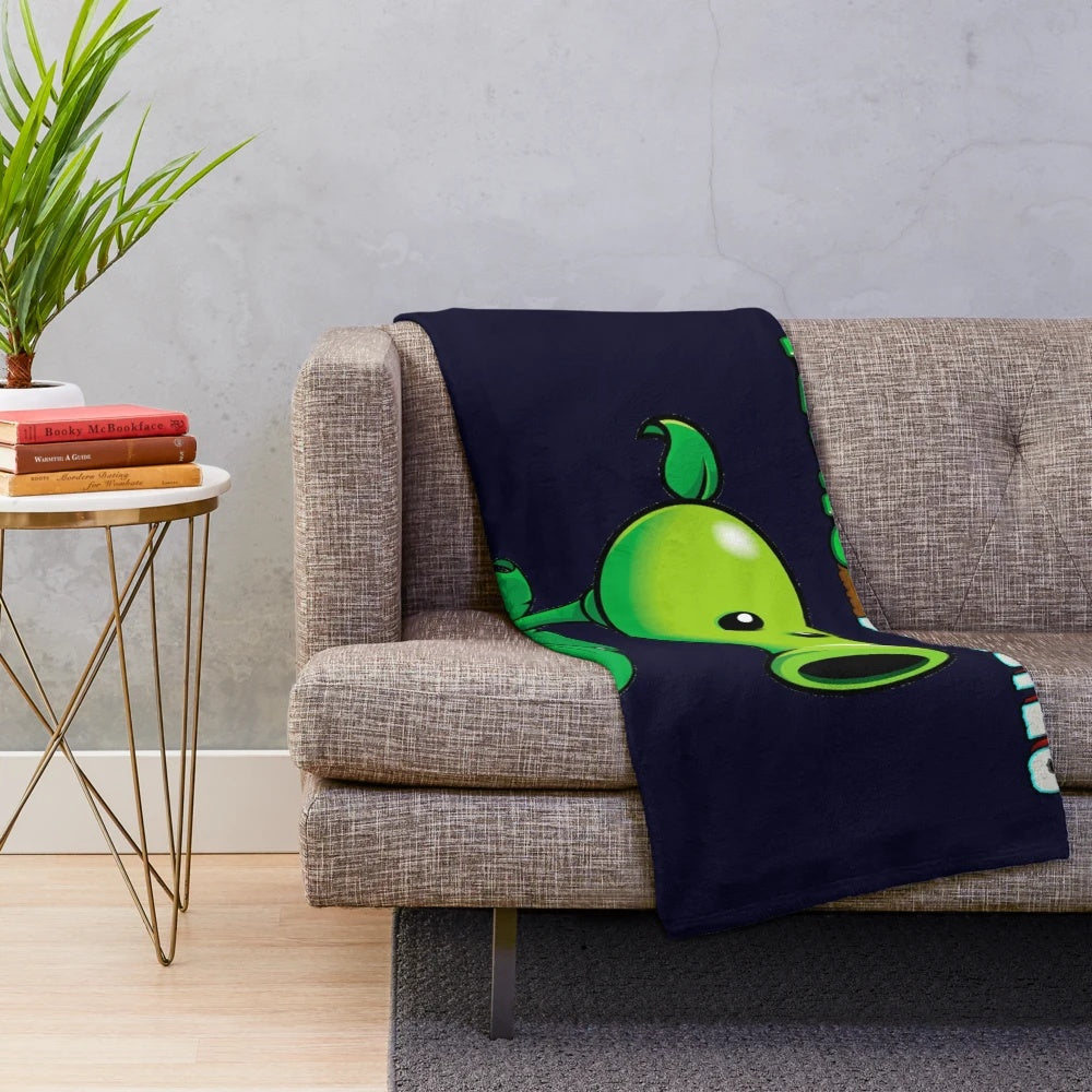 Peashooter-inspired plush blanket featuring the iconic Plants vs Zombies character