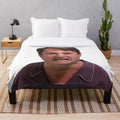 Mark Corrigan from Peep Show on a plush Christmas blanket