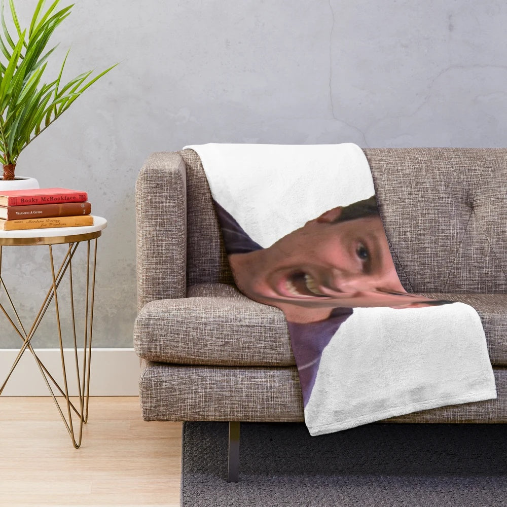 Mark Corrigan from Peep Show on a plush Christmas blanket