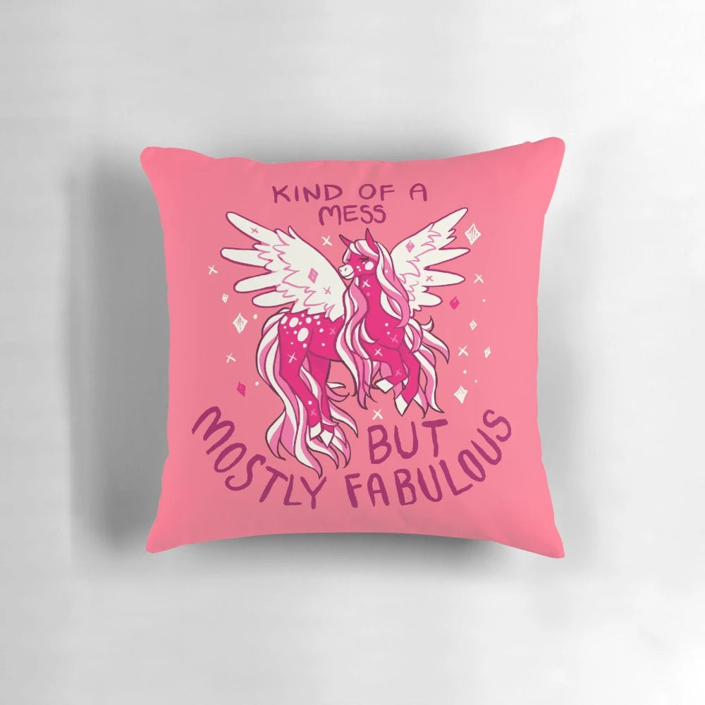 A pink and sparkly pegasus-themed pillow with the text "KIND OF A MESS" on it, representing self-love and acceptance.