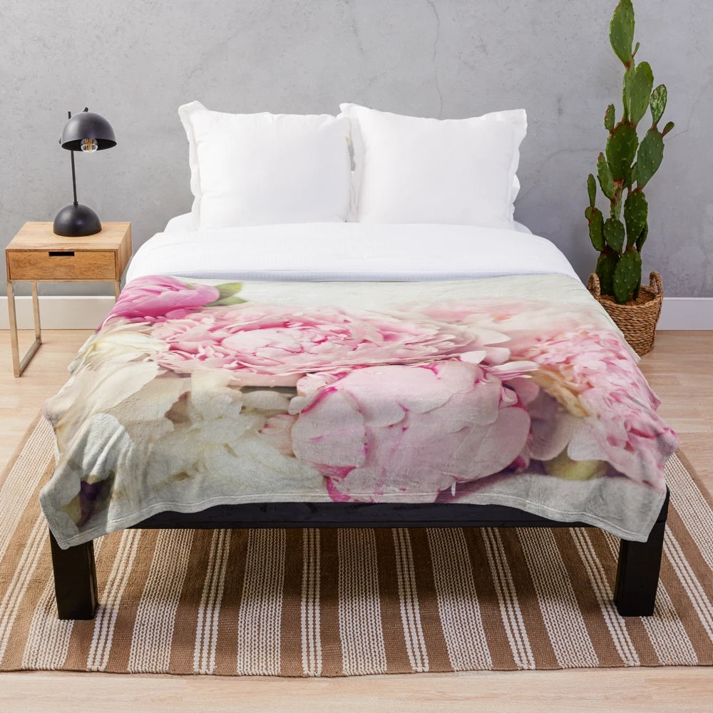 Peonies floral pattern on a white plush blanket